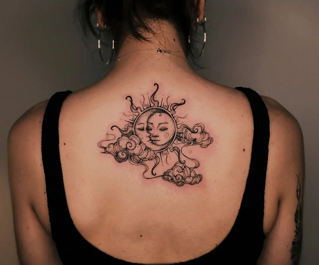 Elegant sun and cloud tattoo creation.