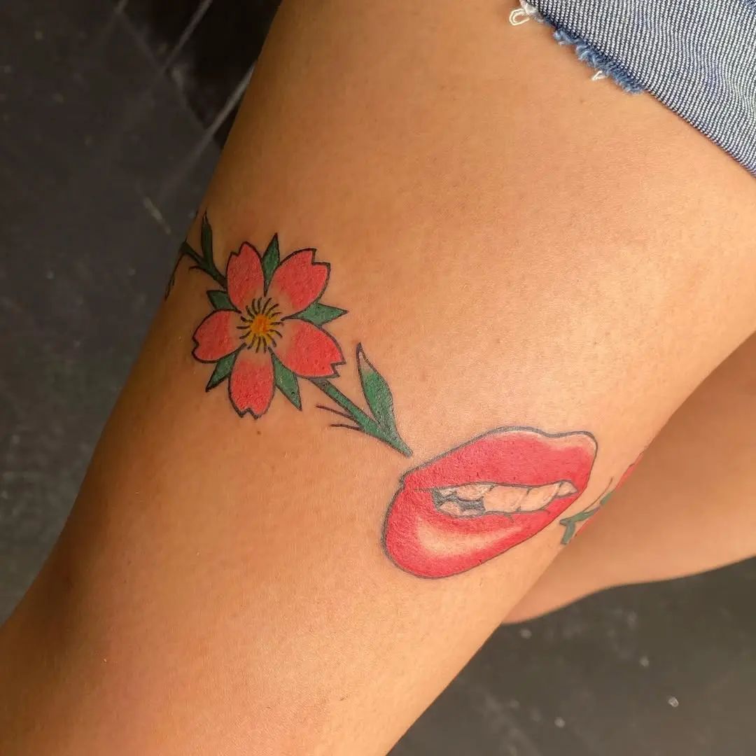 Vibrant Lips and Floral Tattoo Design