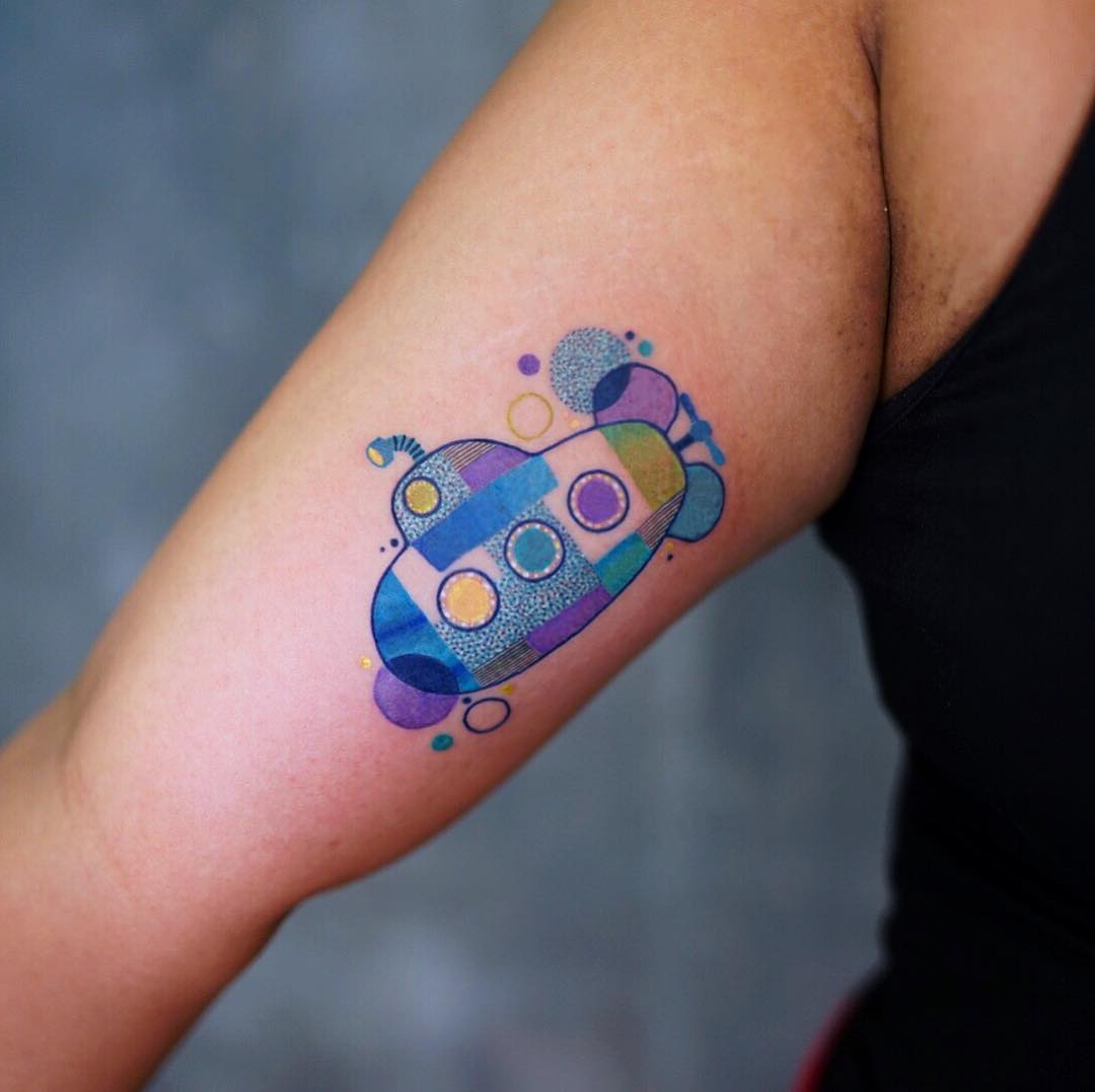 Colorful submarine tattoo embodies playful creativity