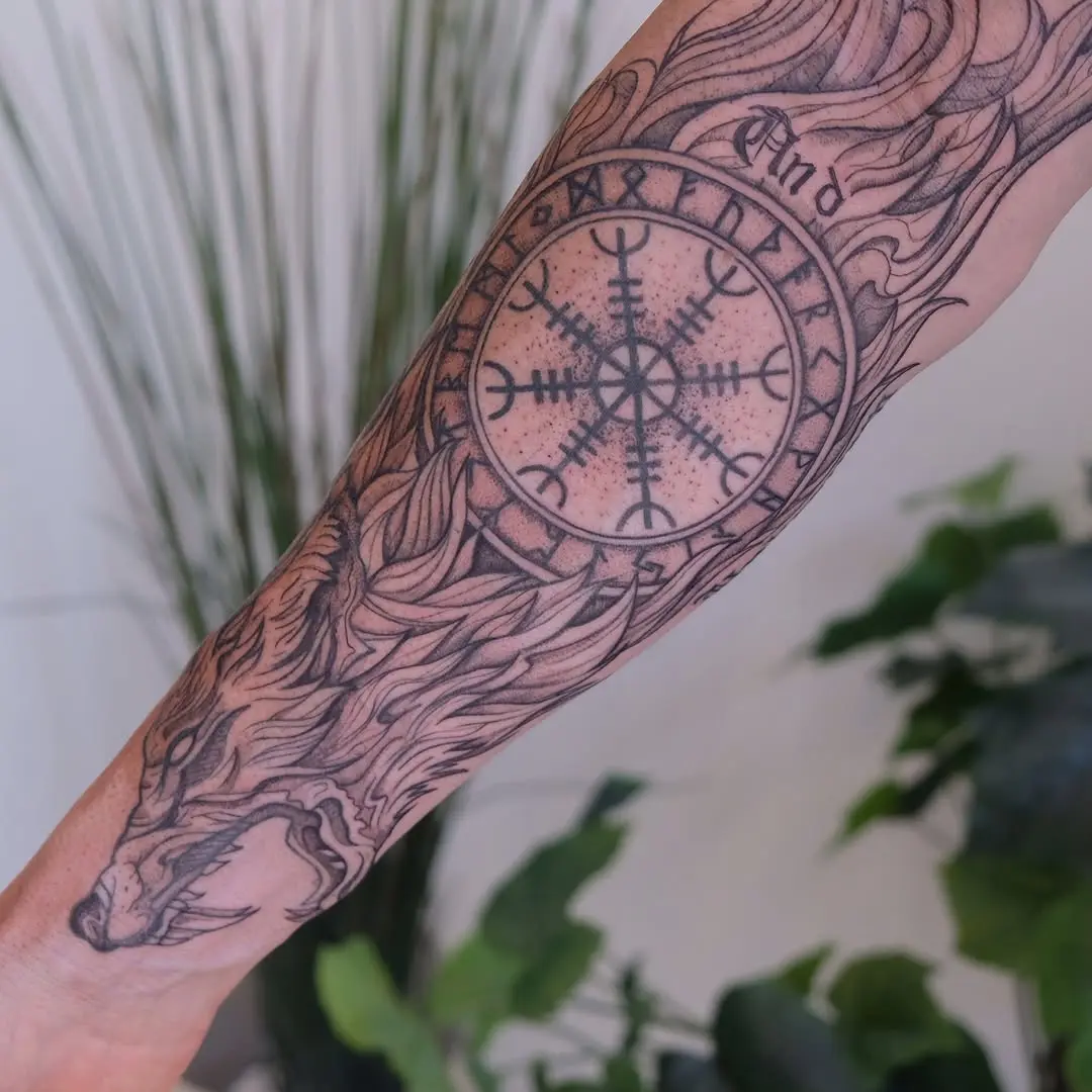 Intricate Viking tattoo featuring a wolf and symbol