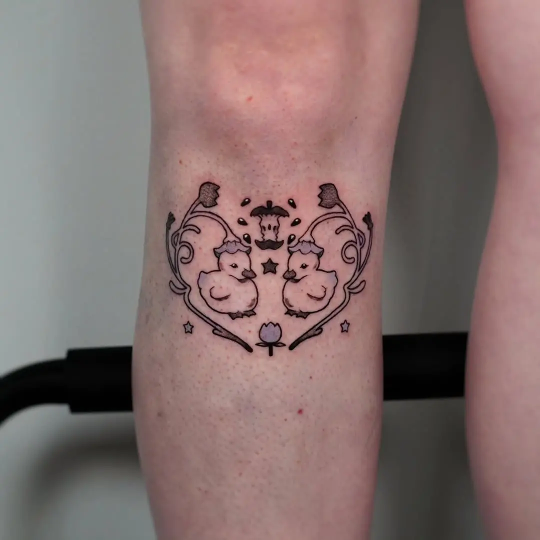 Charming duck tattoo with floral accents