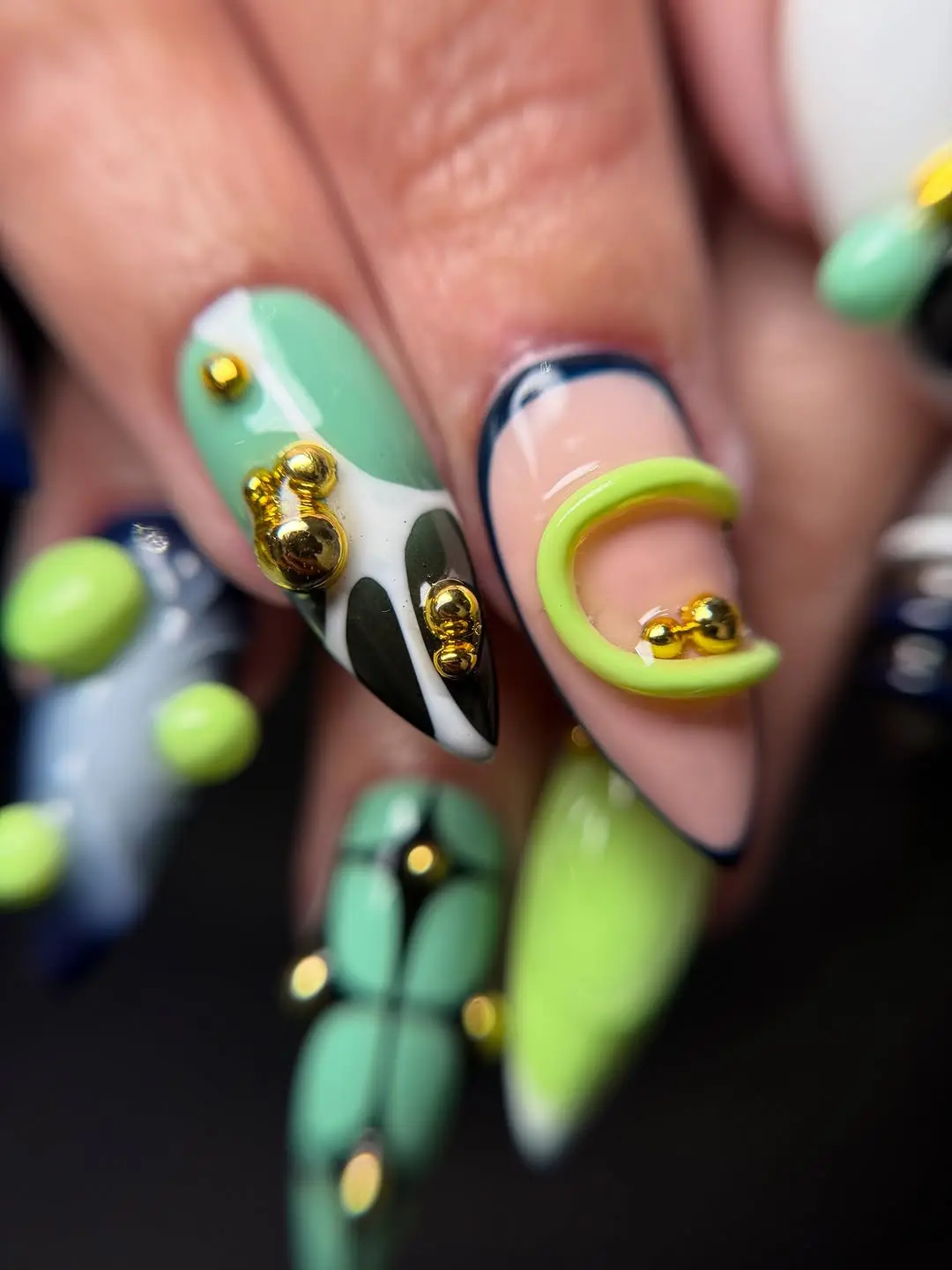 Stylish 3D Nail Art with Gold Accents