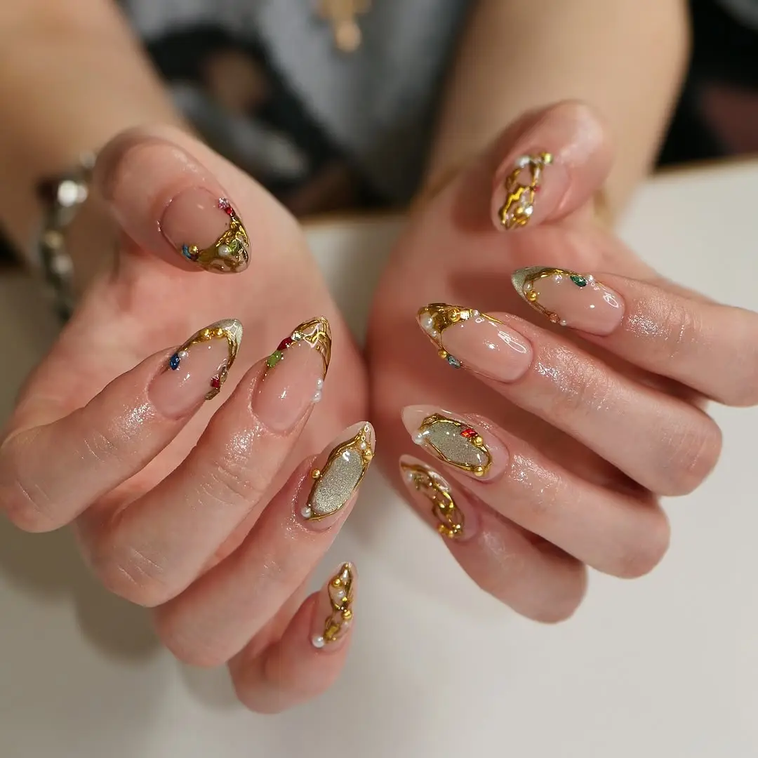 Elegant 3D nails adorned with gold accents