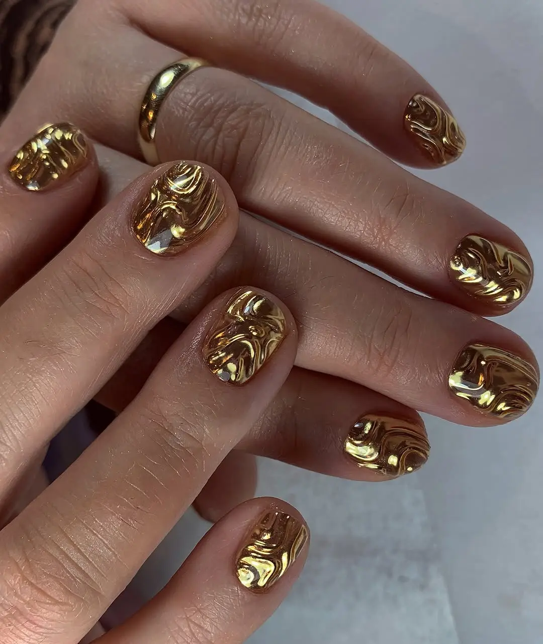 Luxurious gold marble 3D nail art design