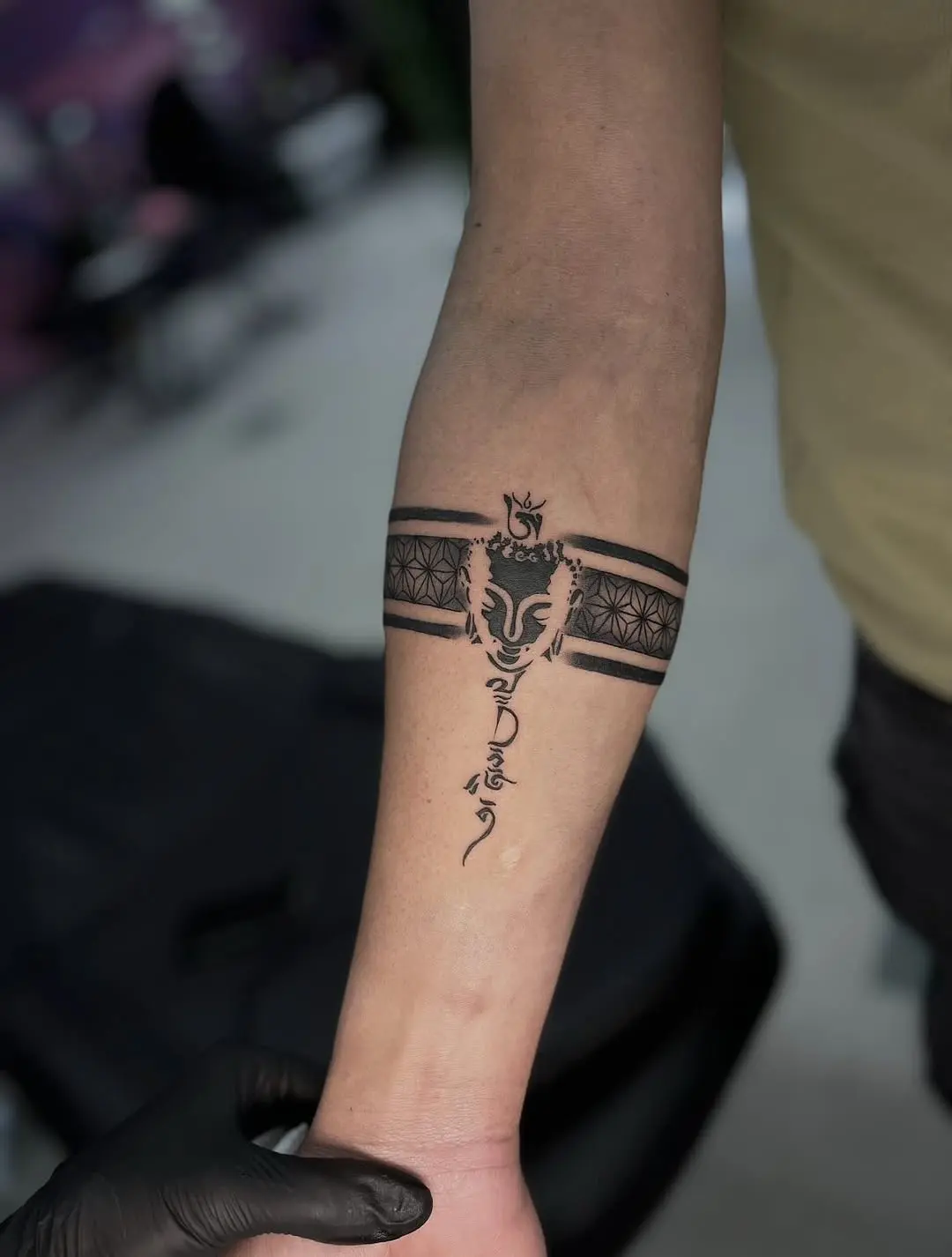 Intricate black armband tattoo with unique pattern