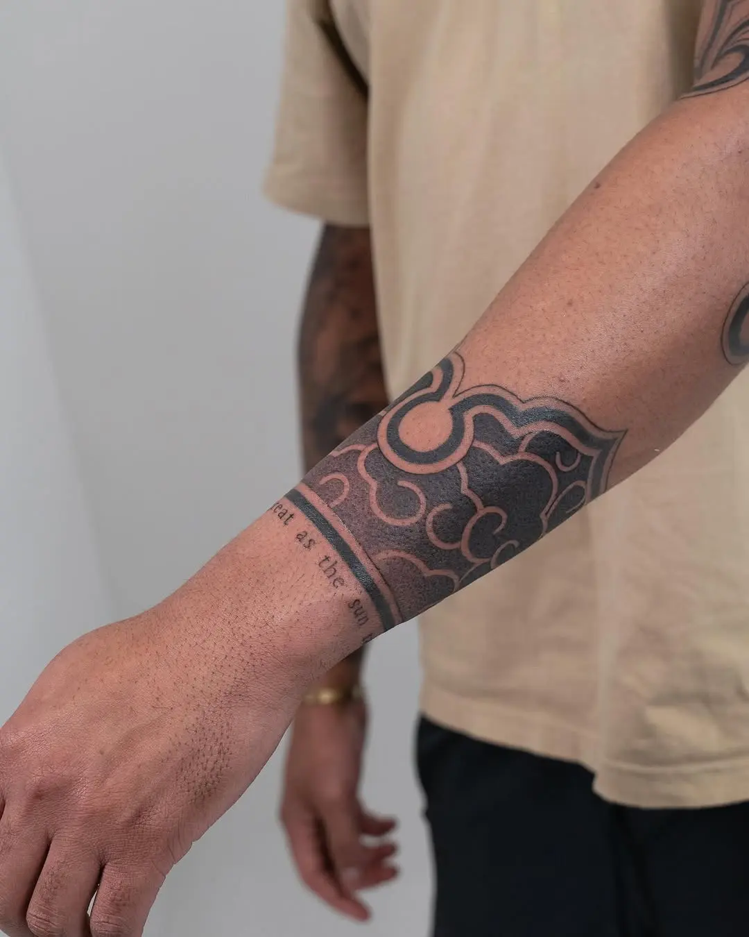 Bold black ink swirls for modern armbands