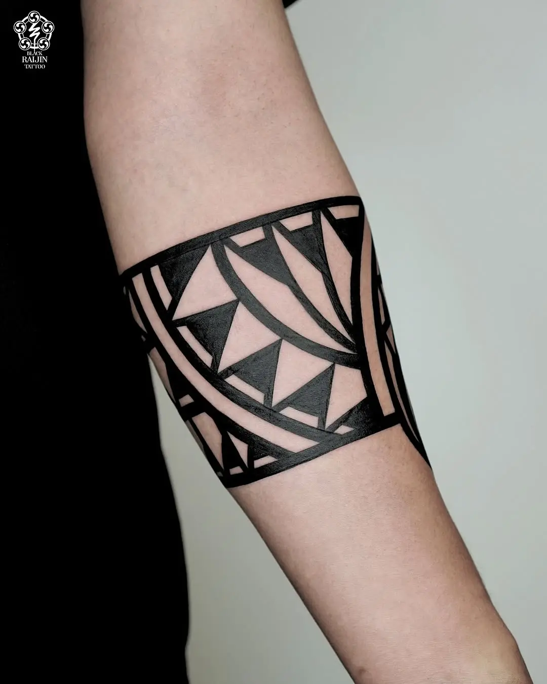 Bold geometric armband tattoo for statement style