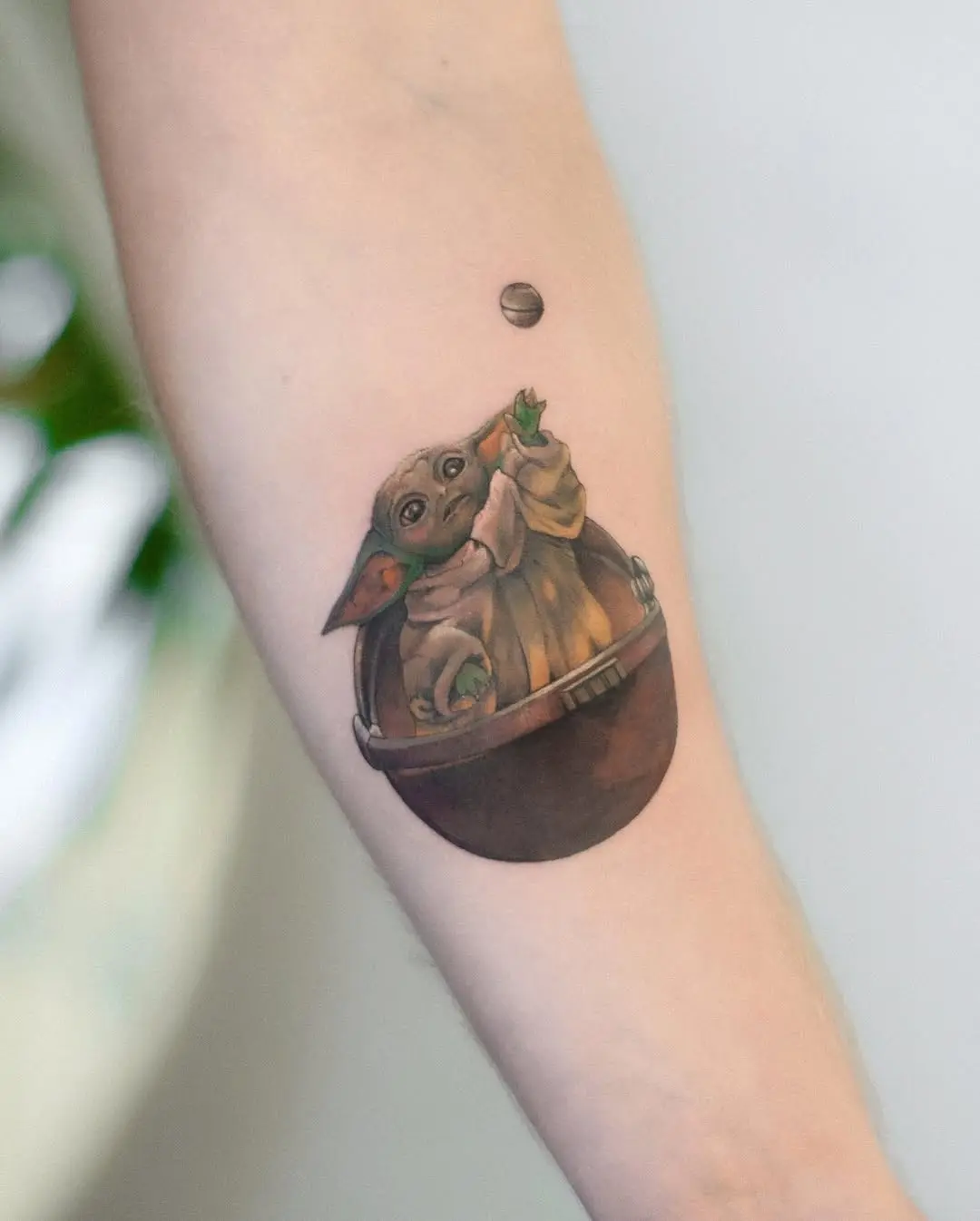 Adorable Baby Yoda in a unique tattoo design