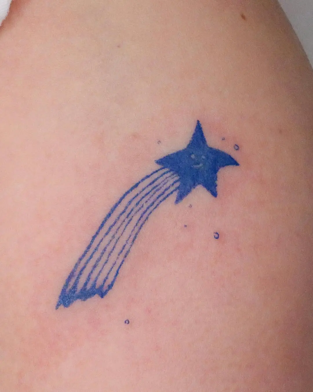 Charming Blue Shooting Star Tattoo Design