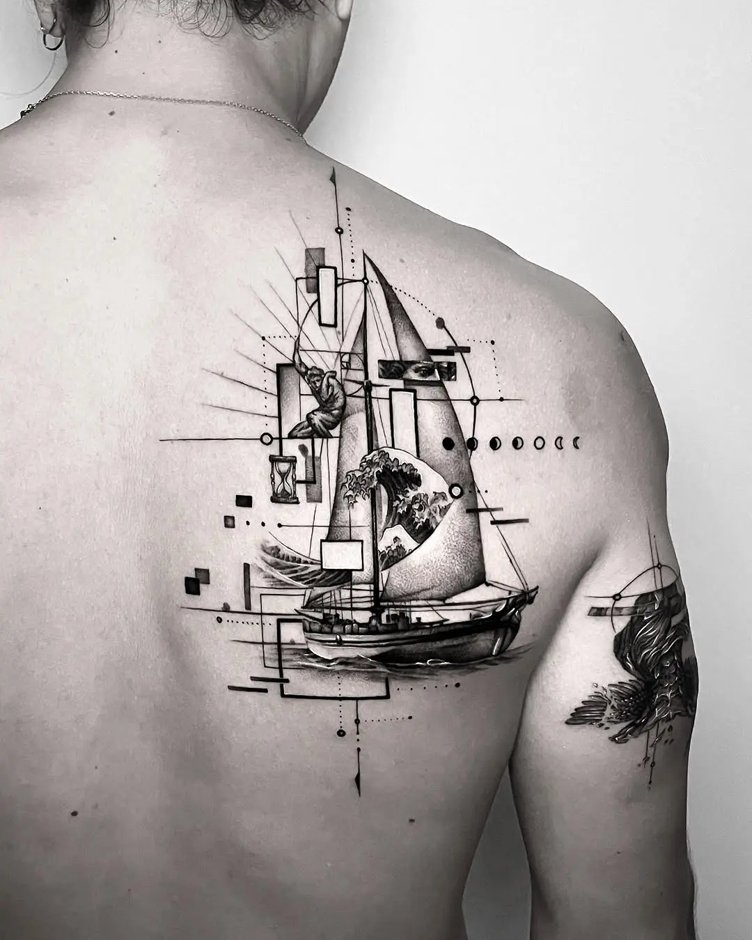 Artistic boat tattoo blending nature and geometry