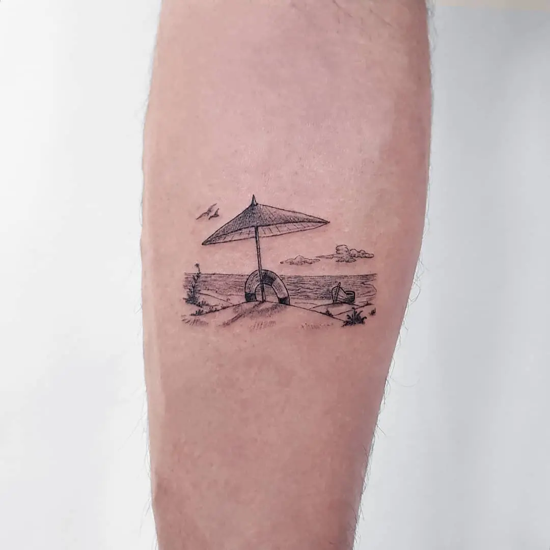 Charming beach scene boat tattoo