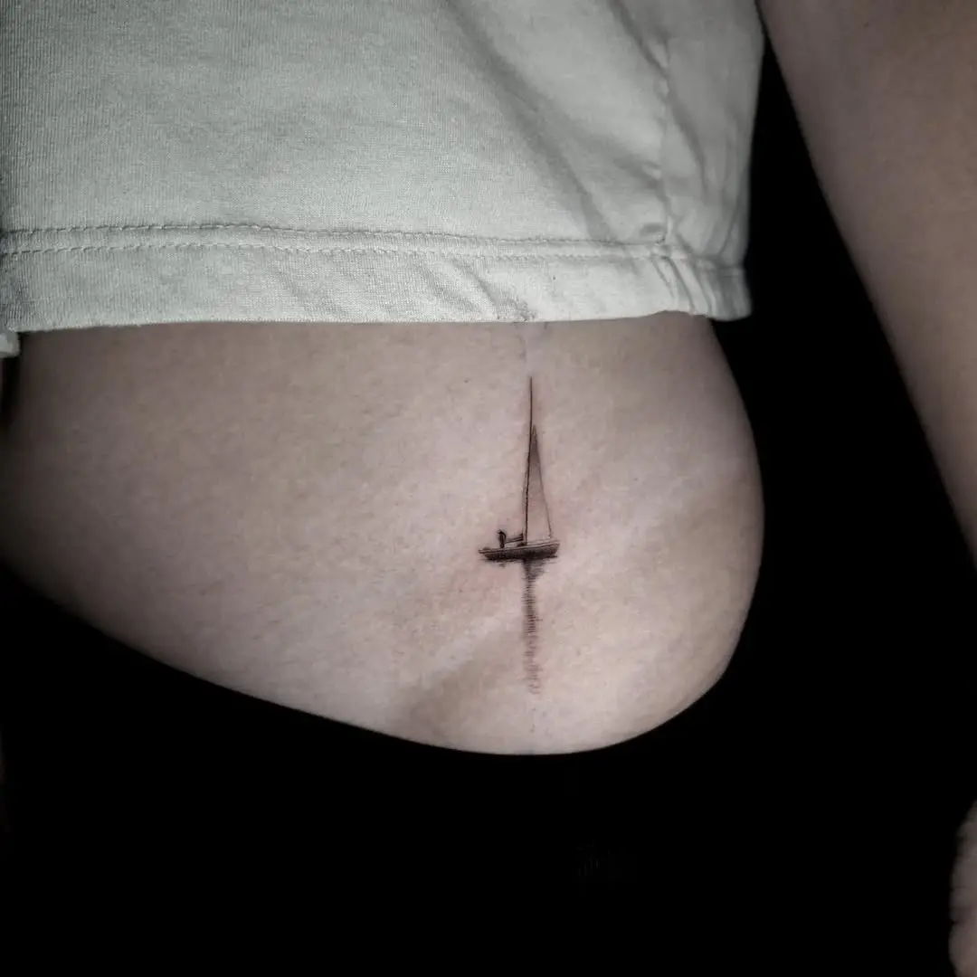 Elegant sailing boat tattoo on the side