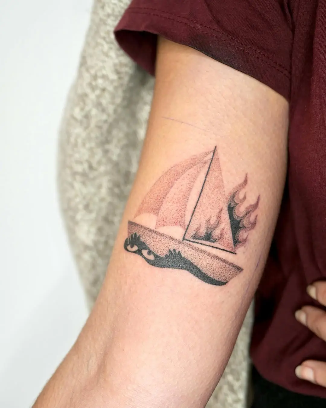 Stylish boat tattoo showcasing dynamic elements