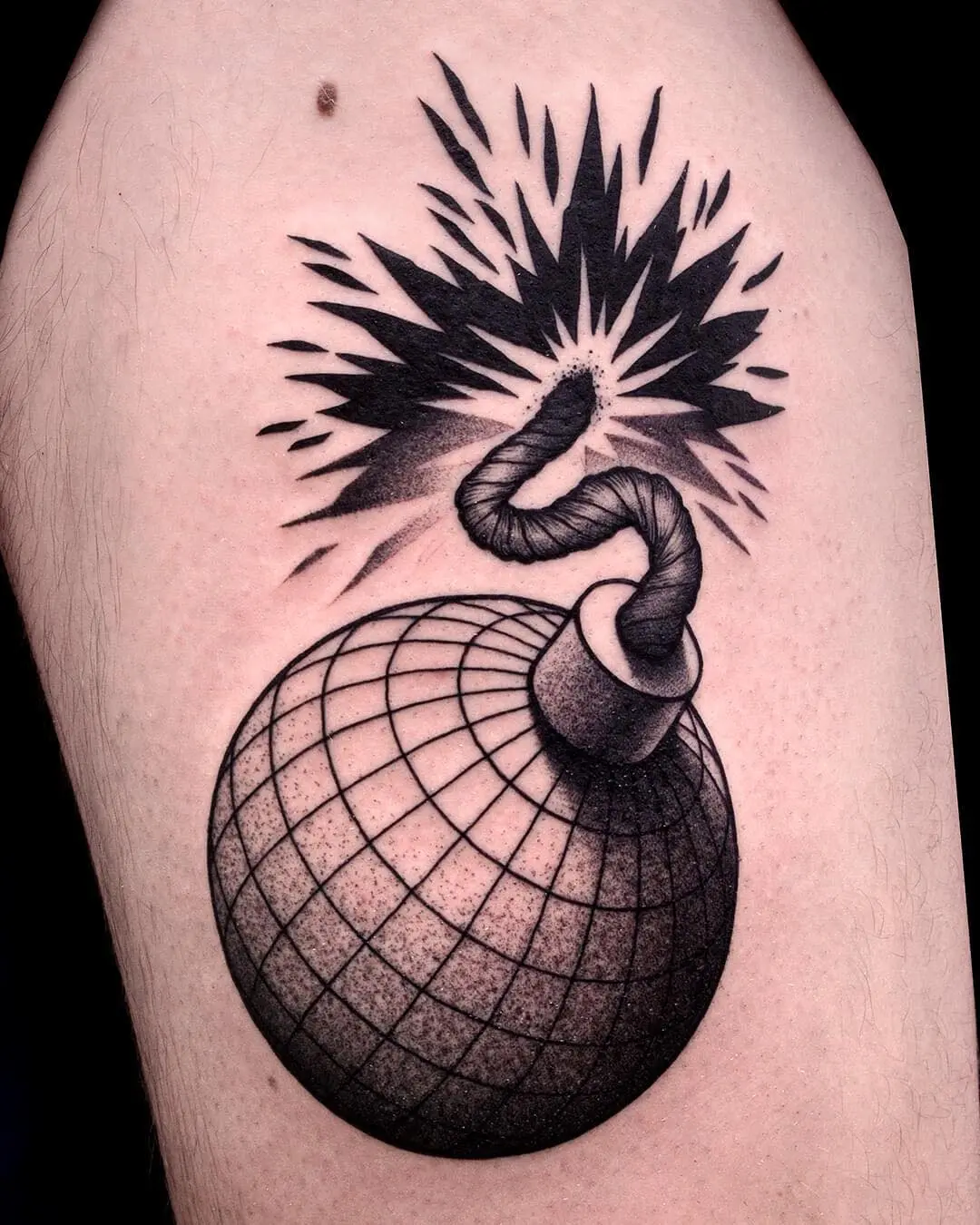 Explosive tattoo combining art and symbolism