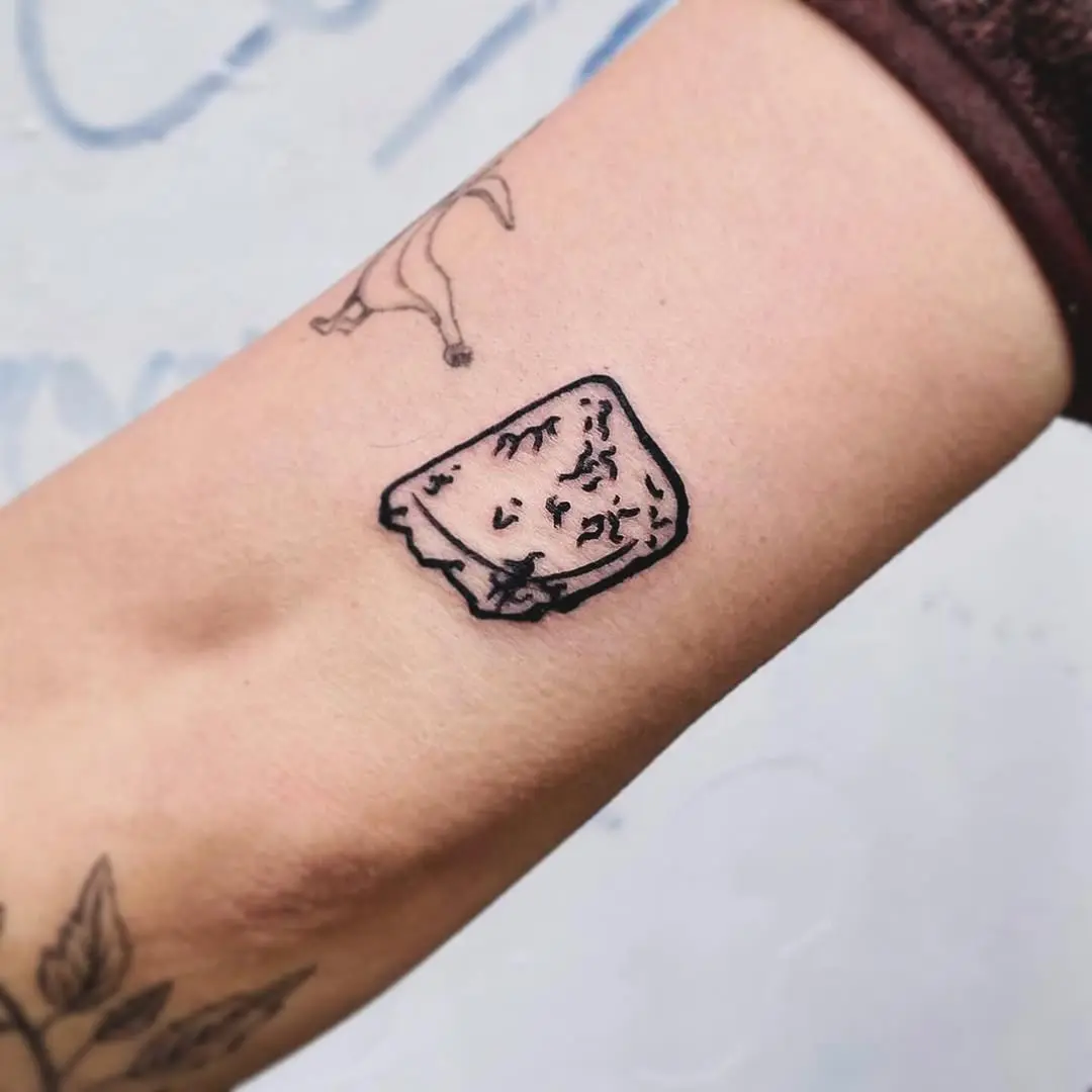 Charming Minimalist Cheese Tattoo on Forearm