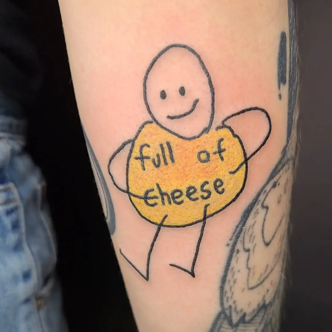 Whimsical cheese tattoo with playful vibes