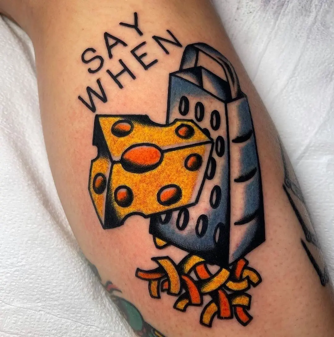 Cheesy Grater Tattoo with a Catchy Phrase