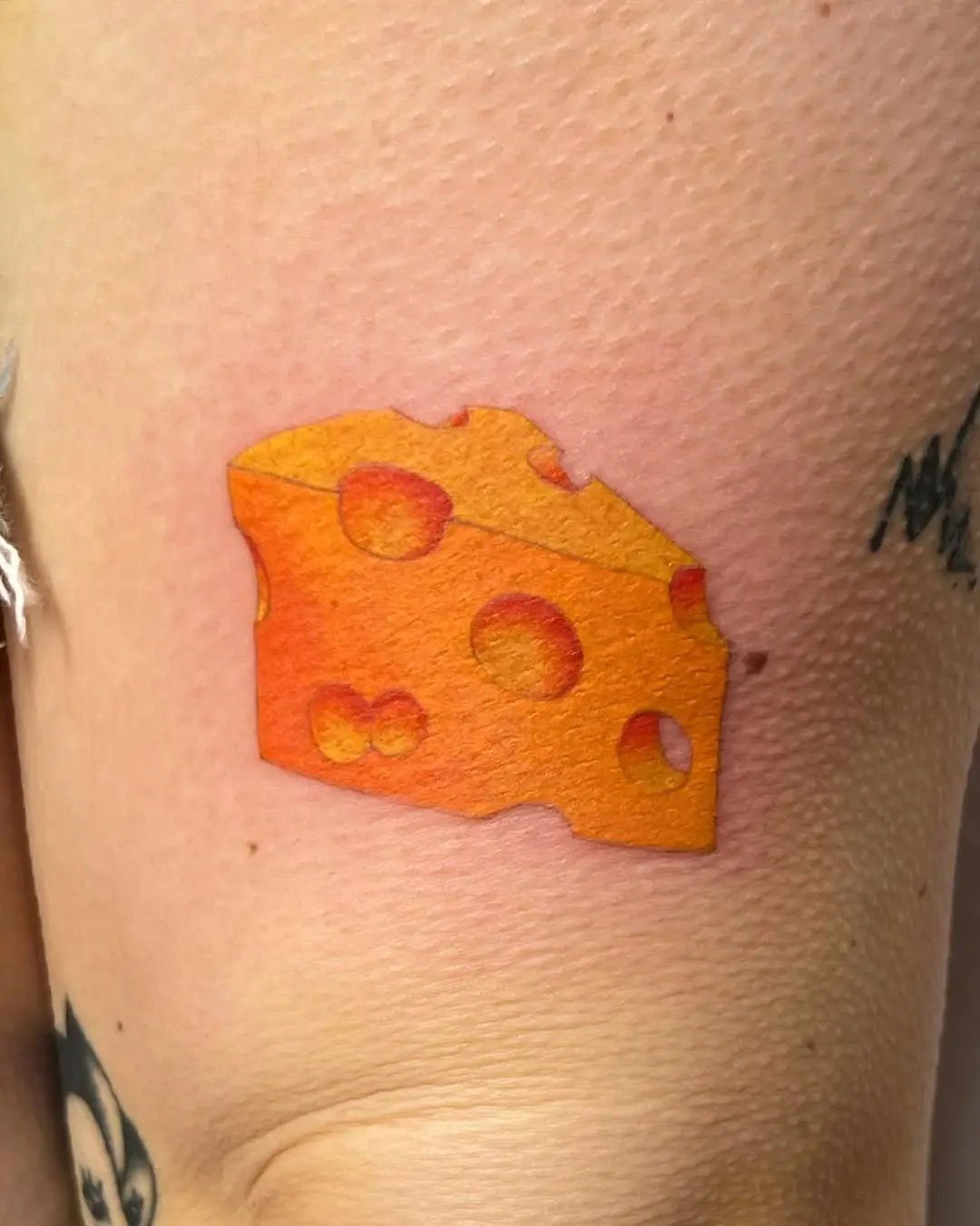 Colorful cheese tattoo with realistic texture