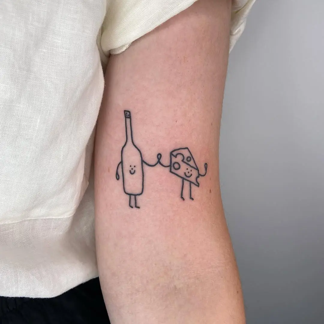 Whimsical cheese and wine tattoo design