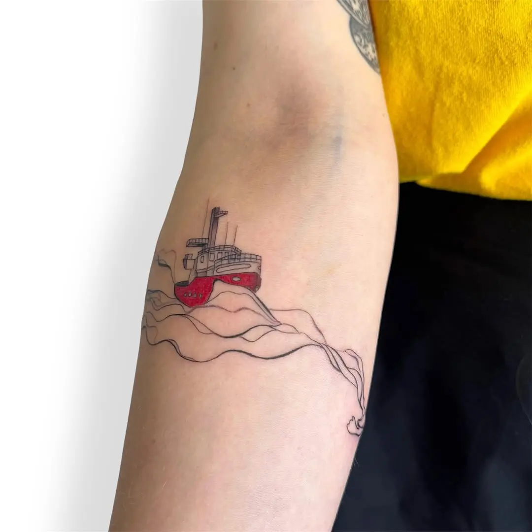 Colorful boat tattoo representing nautical adventure
