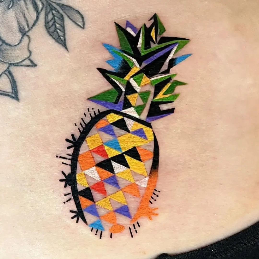Vibrant geometric pineapple tattoo with bold colors