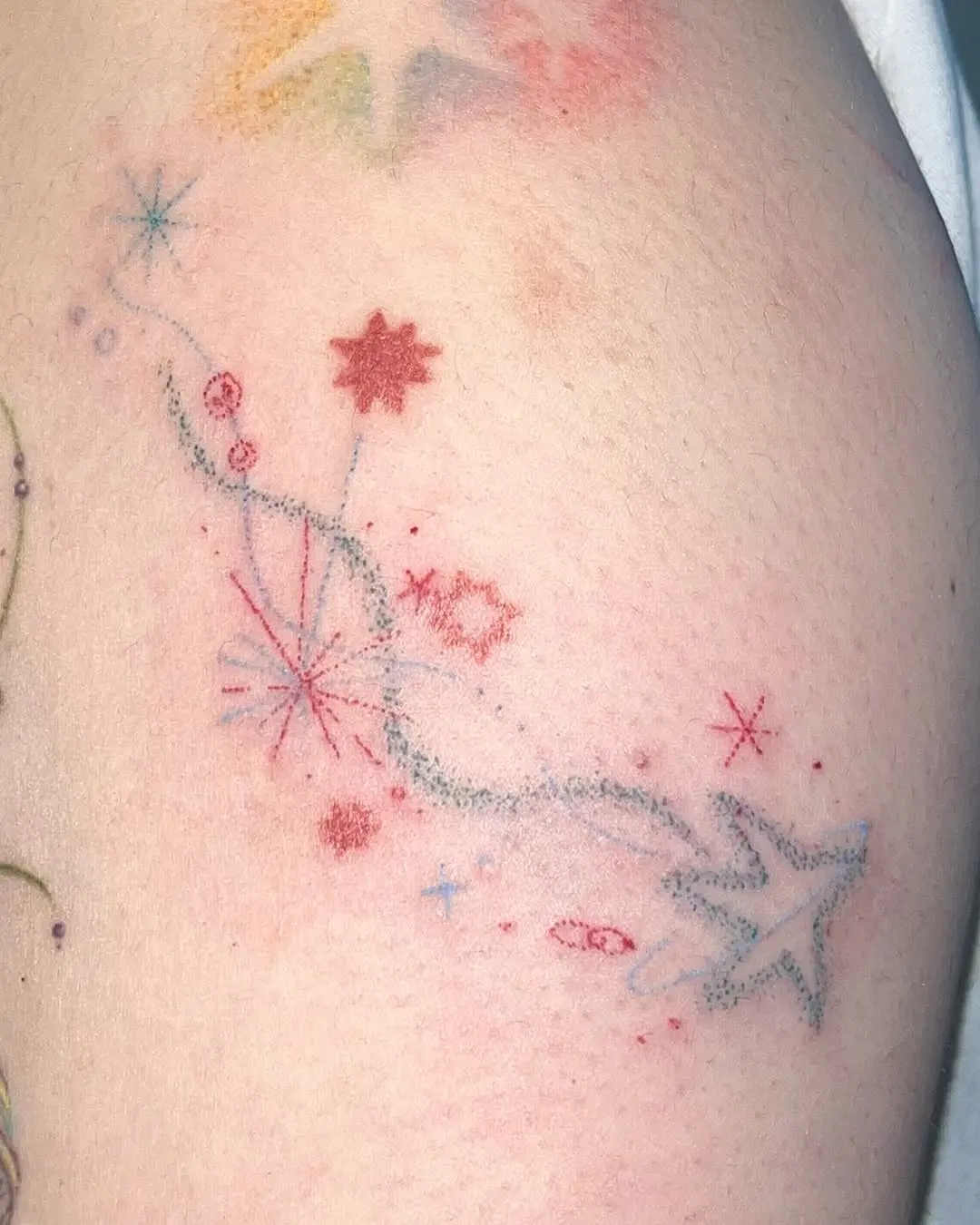 Whimsical Shooting Star Tattoo with Sparkles