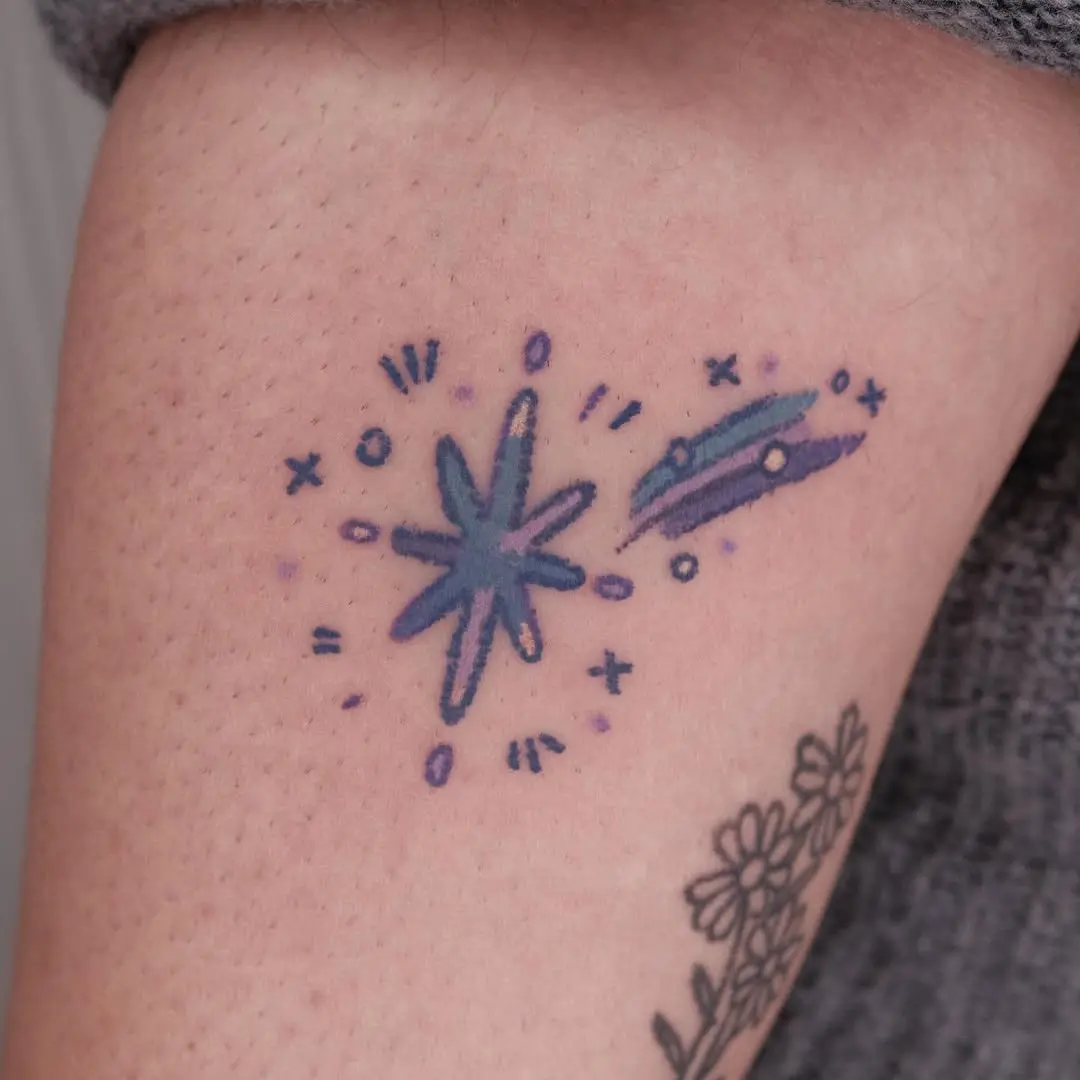 Colorful shooting star tattoo with dynamic flair