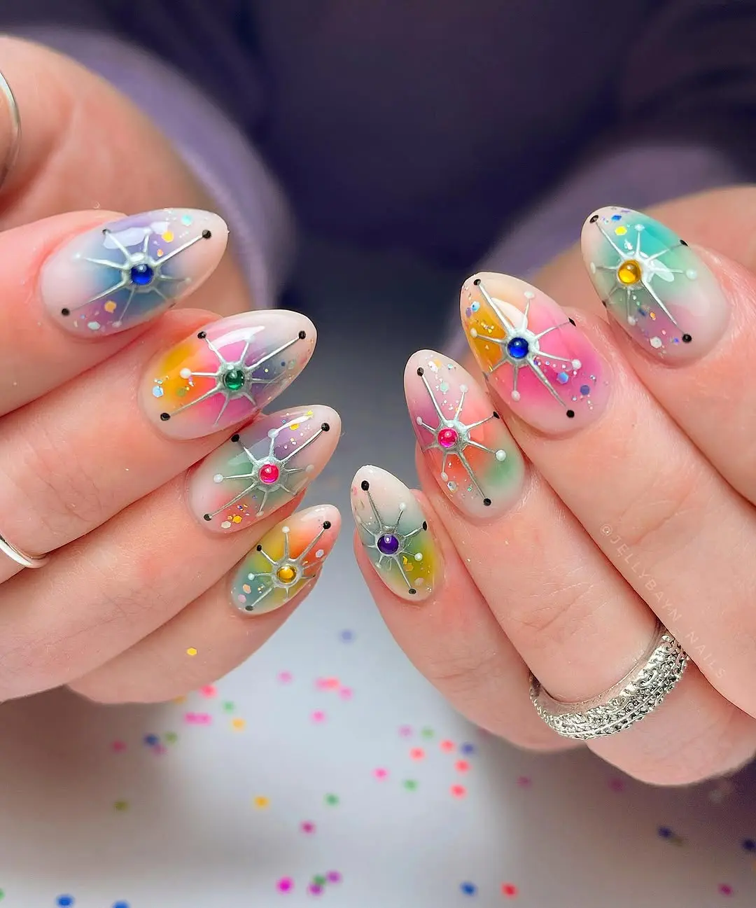 Vibrant pastel winter nails with playful designs