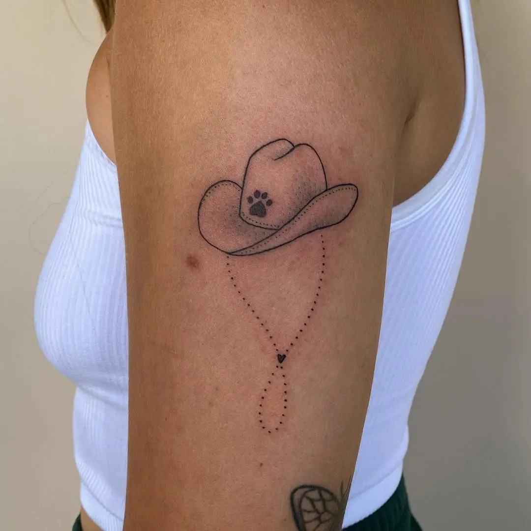 Stylish cowboy hat tattoo with unique paw print