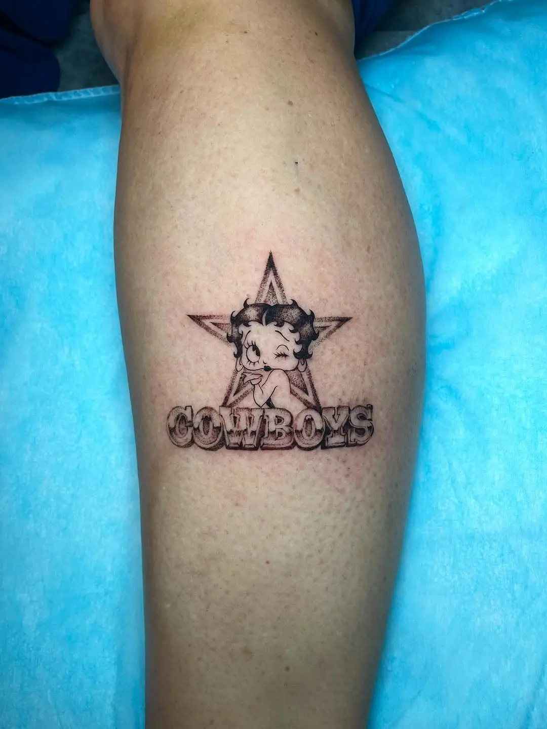 Playful Cowboy Tattoo with Iconic Character