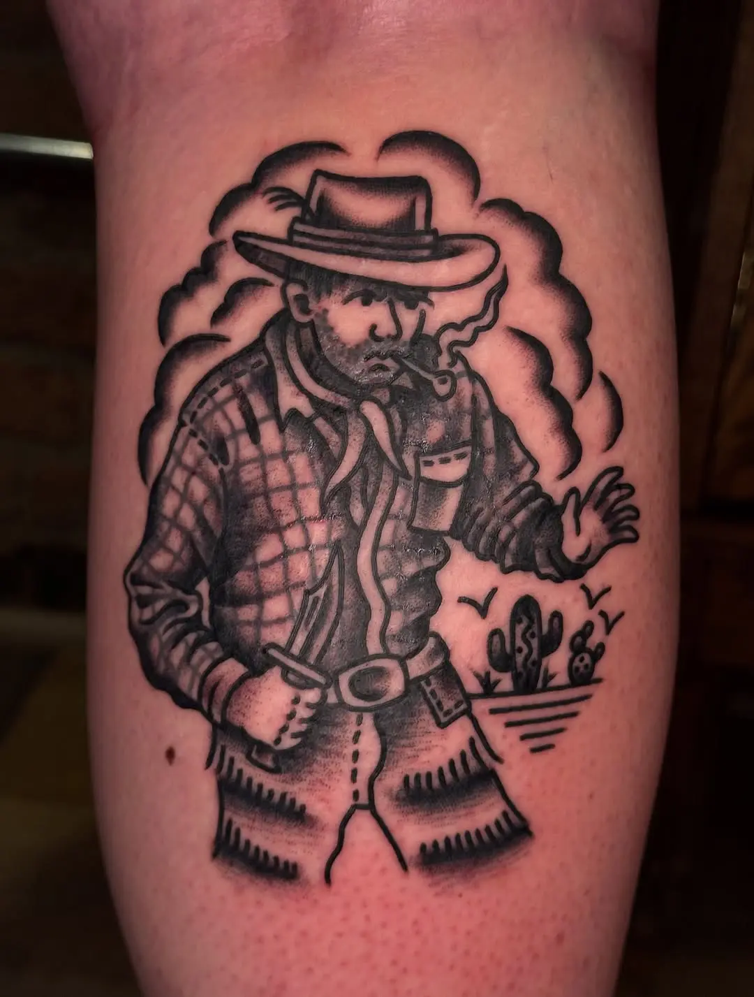 Vintage cowboy tattoo showcasing rugged charm