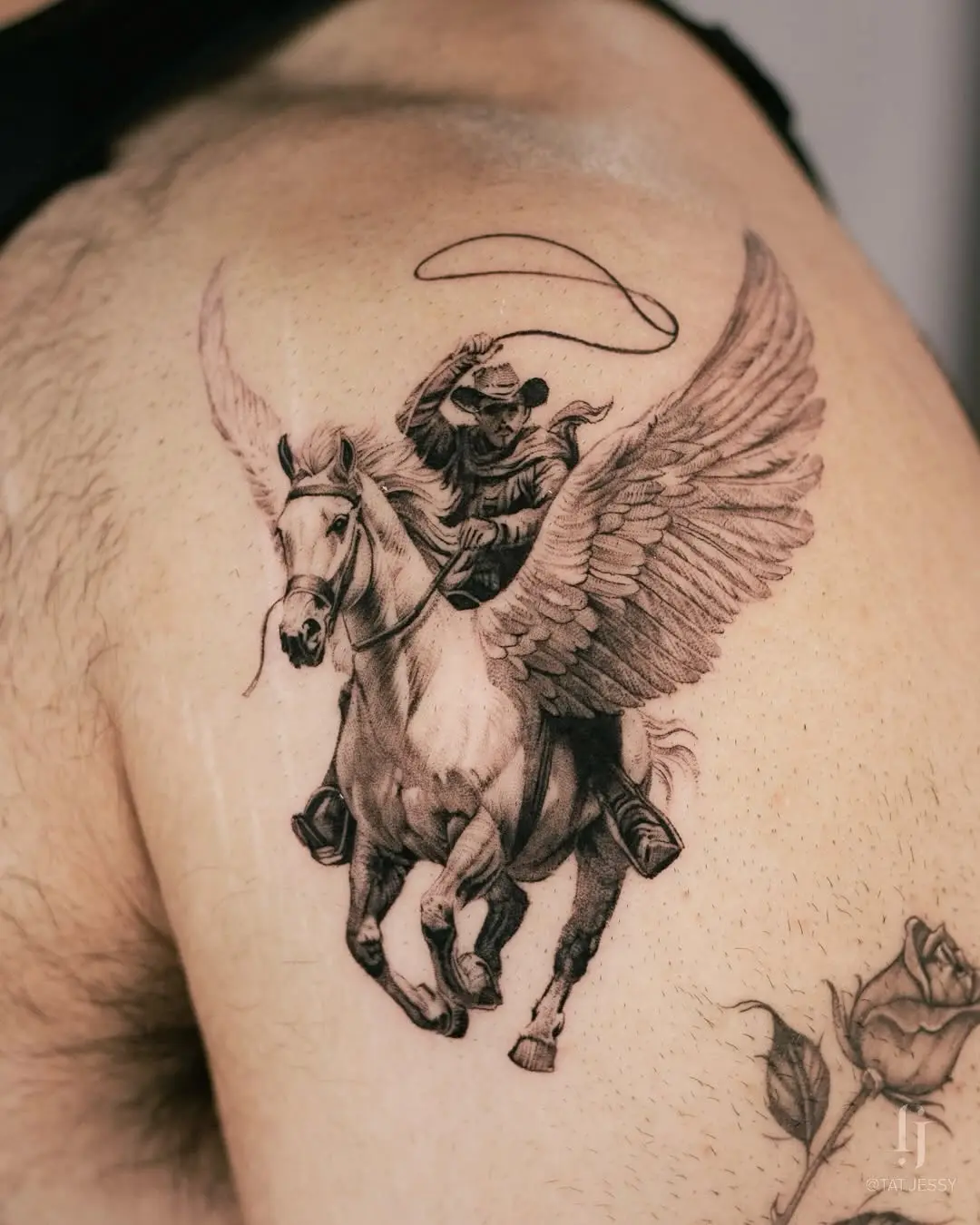 Stunning cowboy tattoo with a winged horse