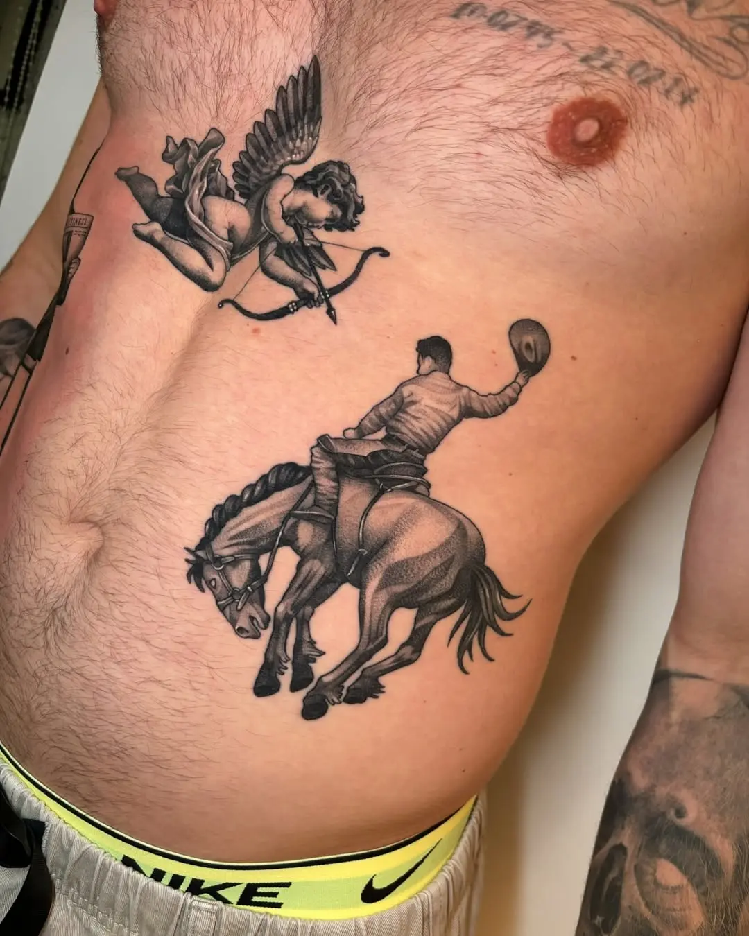 Intricate cowboy tattoo with angelic elements