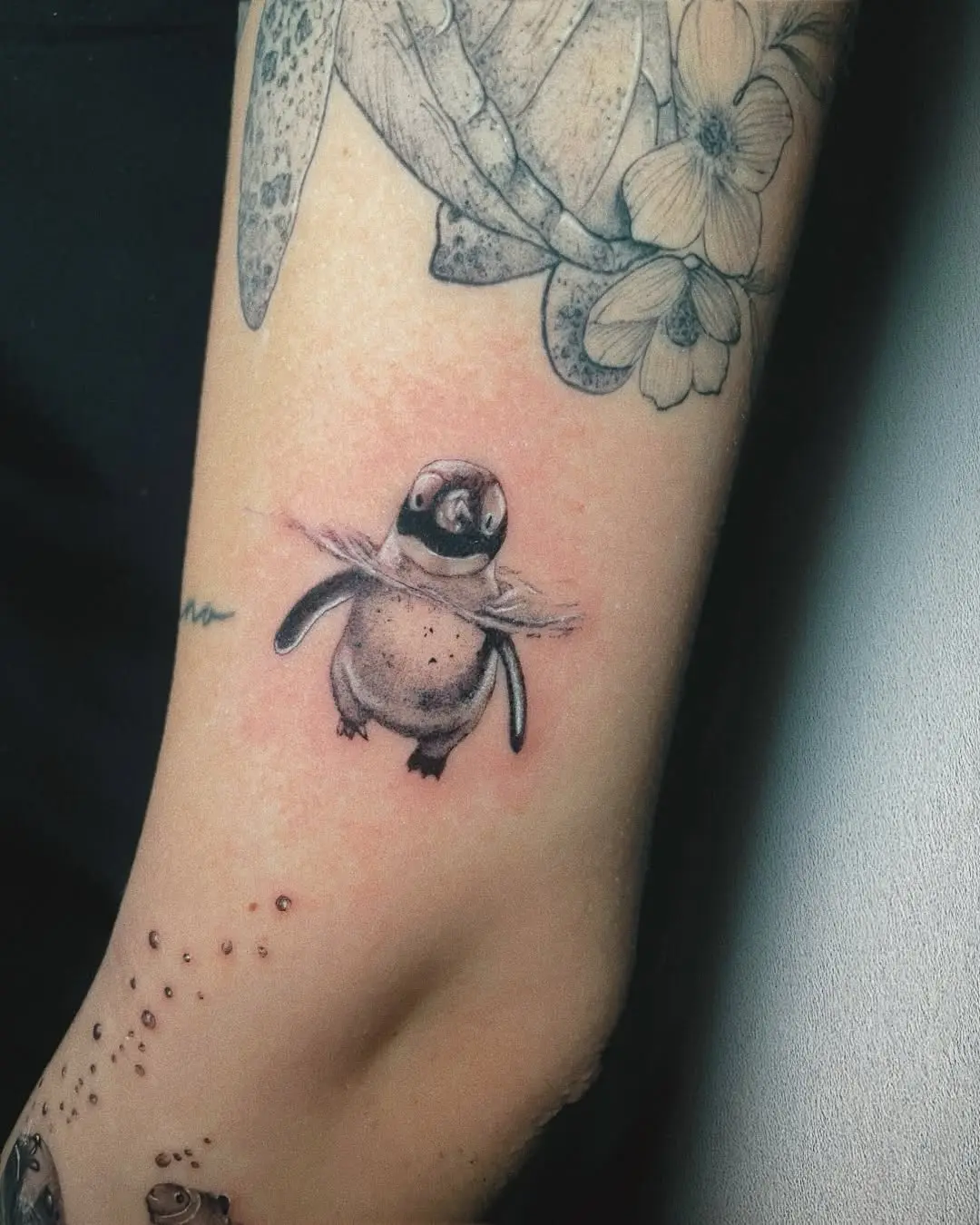 Charming Penguin Tattoo with Playful Vibes