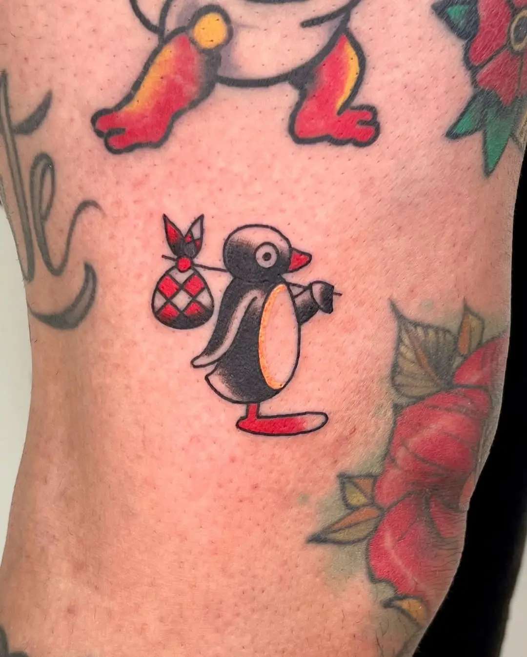 Charming penguin tattoo with playful vibes