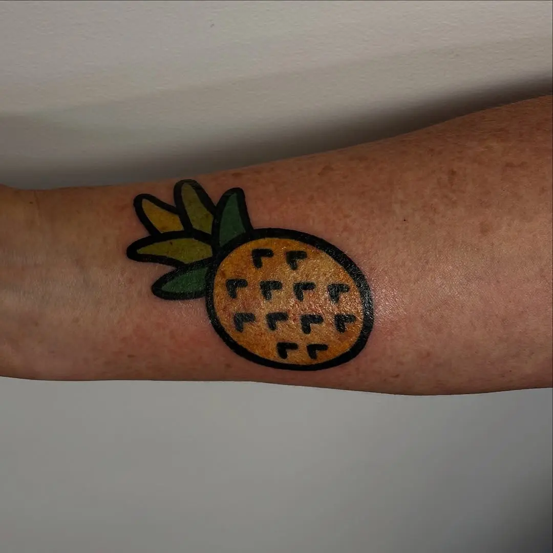 Vibrant Pineapple Tattoo on Forearm