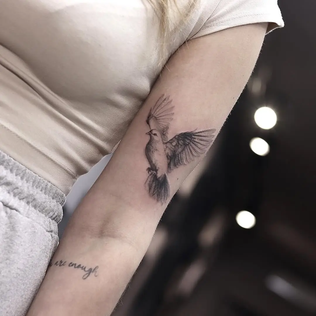 Elegant dove tattoo symbolizing peace and freedom