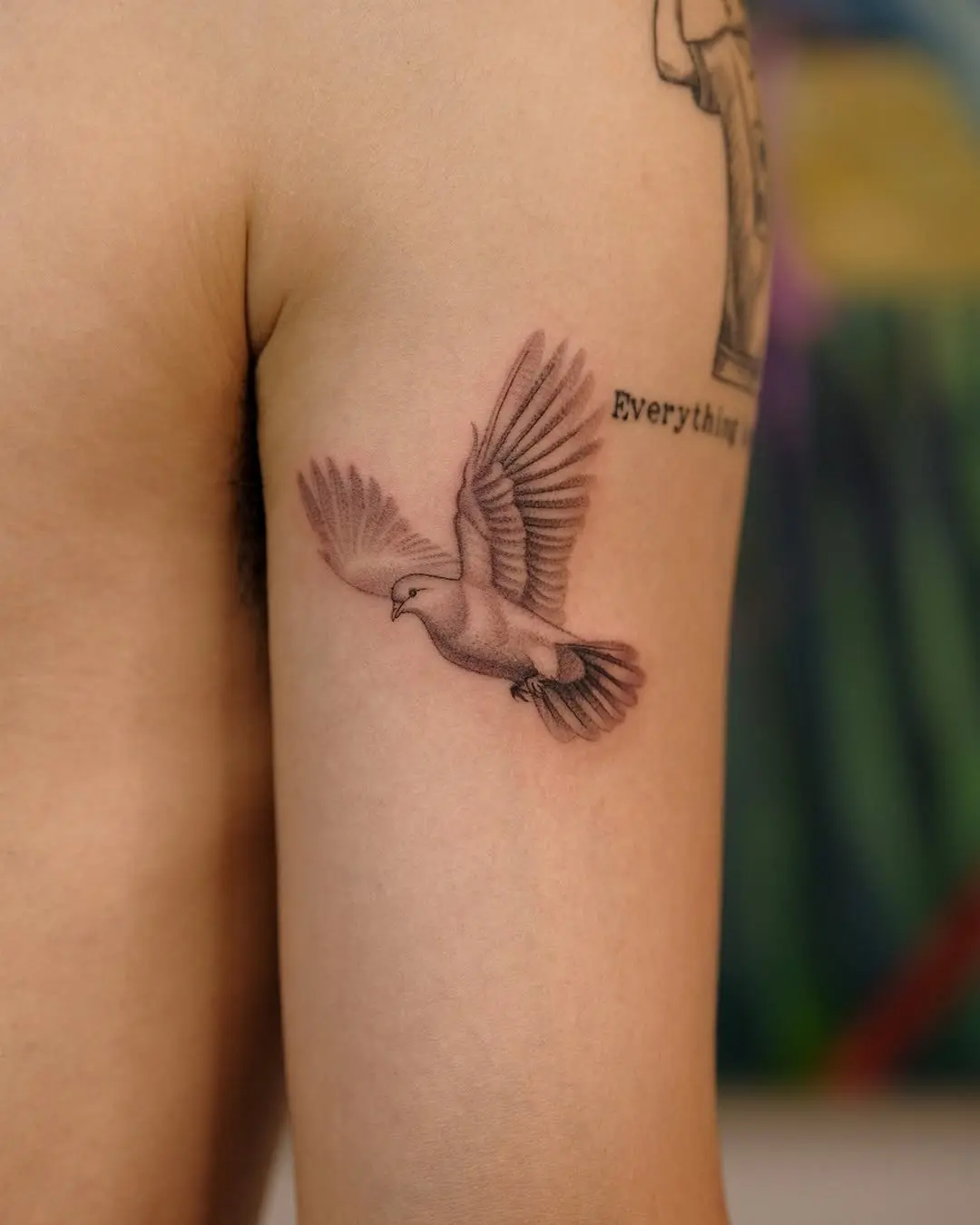 Elegant dove tattoo representing peace and freedom
