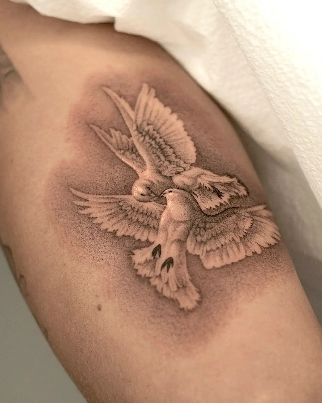 Realistic dove tattoo symbolizes love and freedom