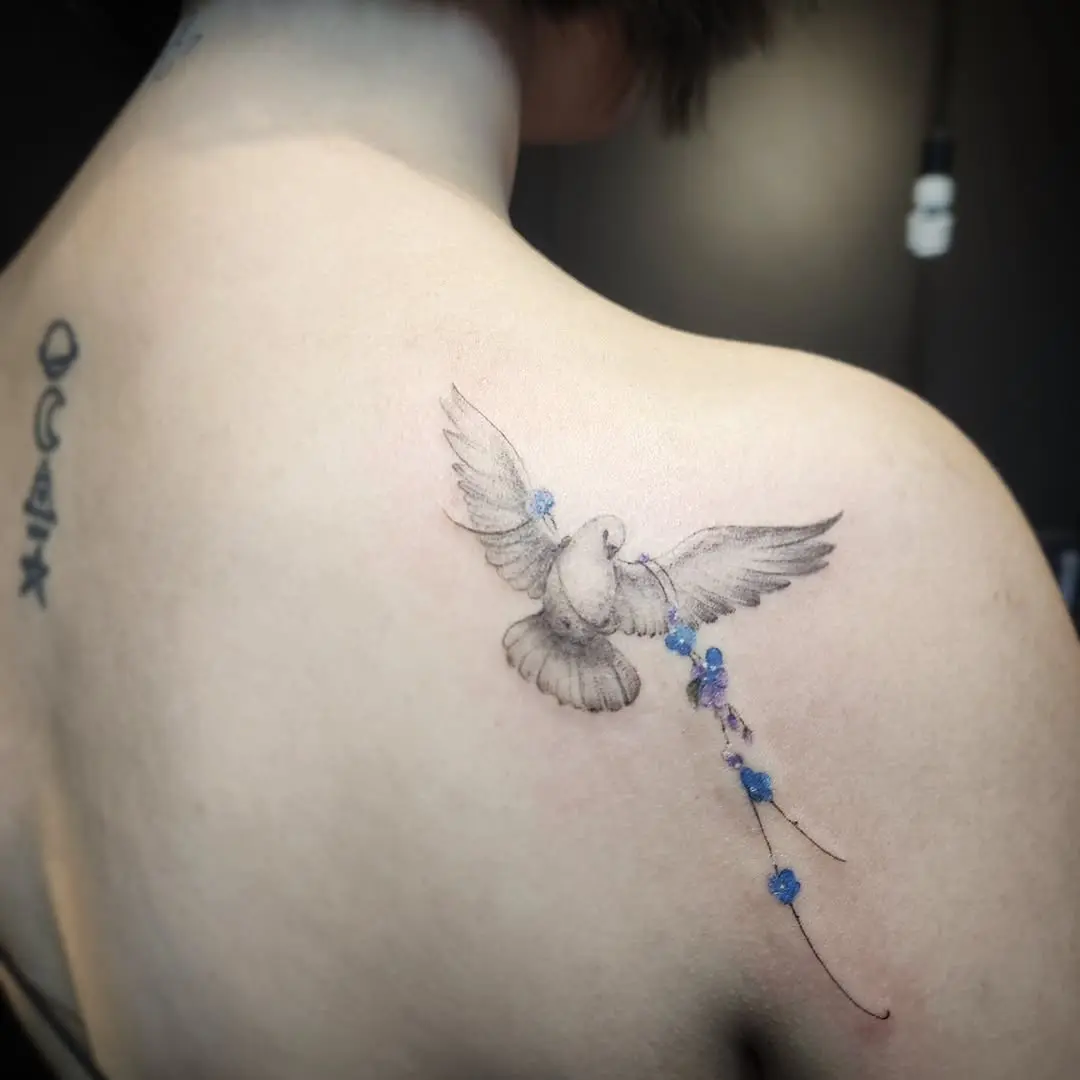 Elegant dove tattoo symbolizing peace and freedom