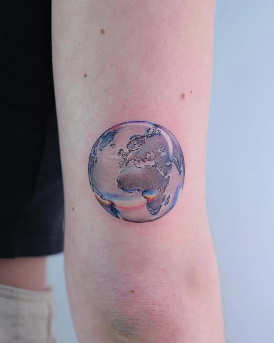 Unique Earth Tattoo Enhancing Natural Beauty