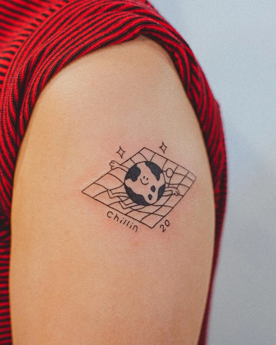 Cute panda tattoo depicting relaxation vibes.