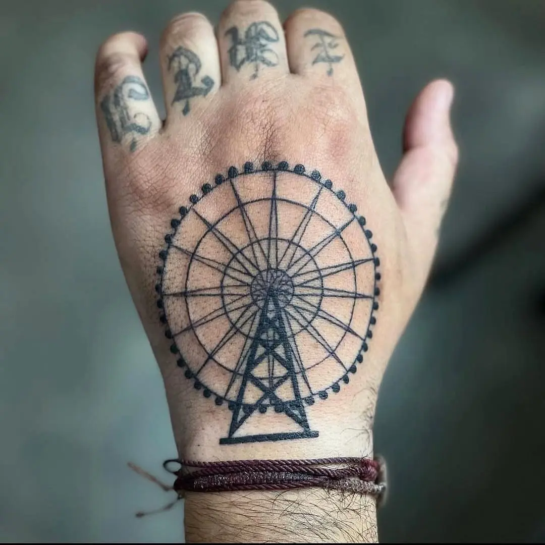 Intricate Ferris wheel tattoo on hand