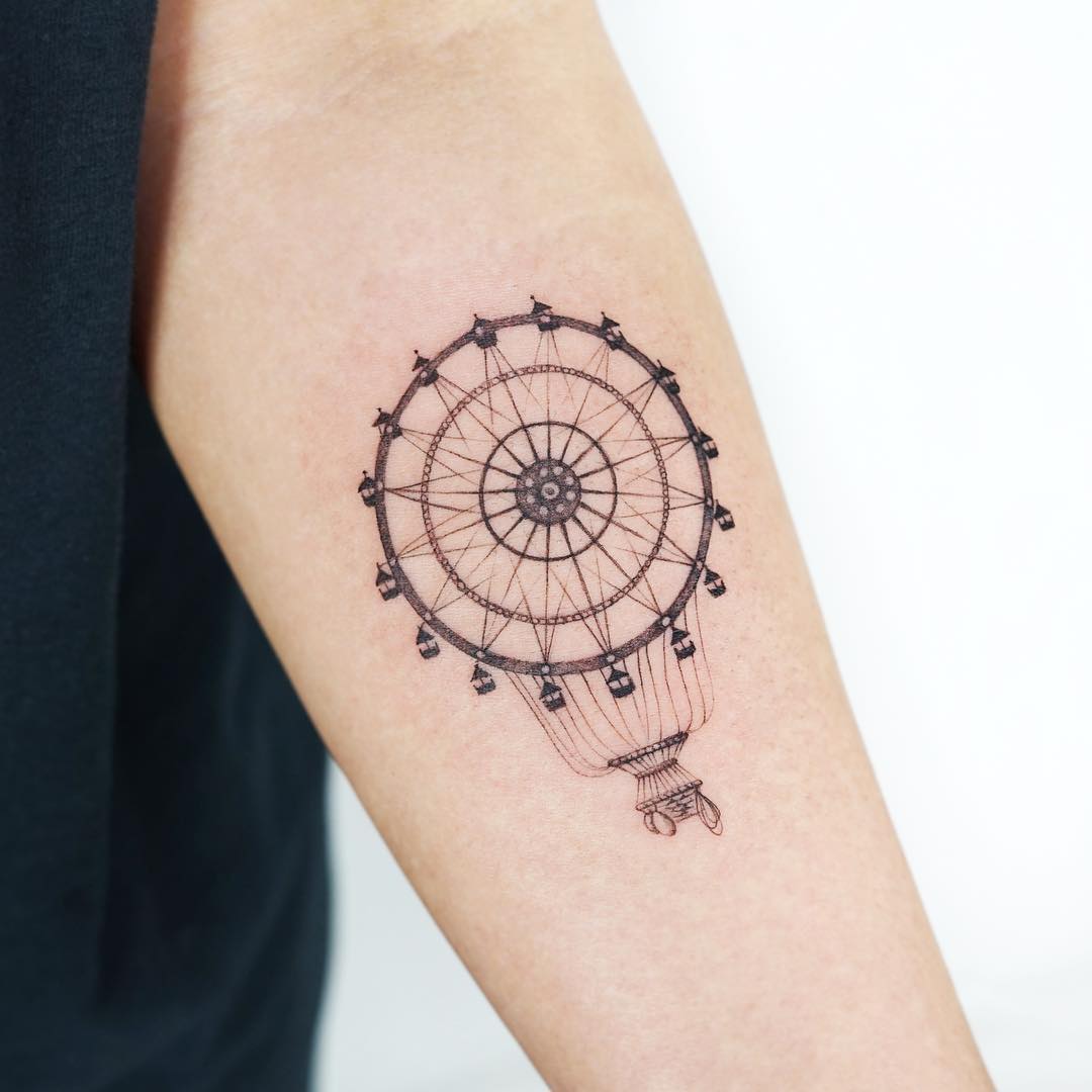 Intricate black outline ferris wheel tattoo design