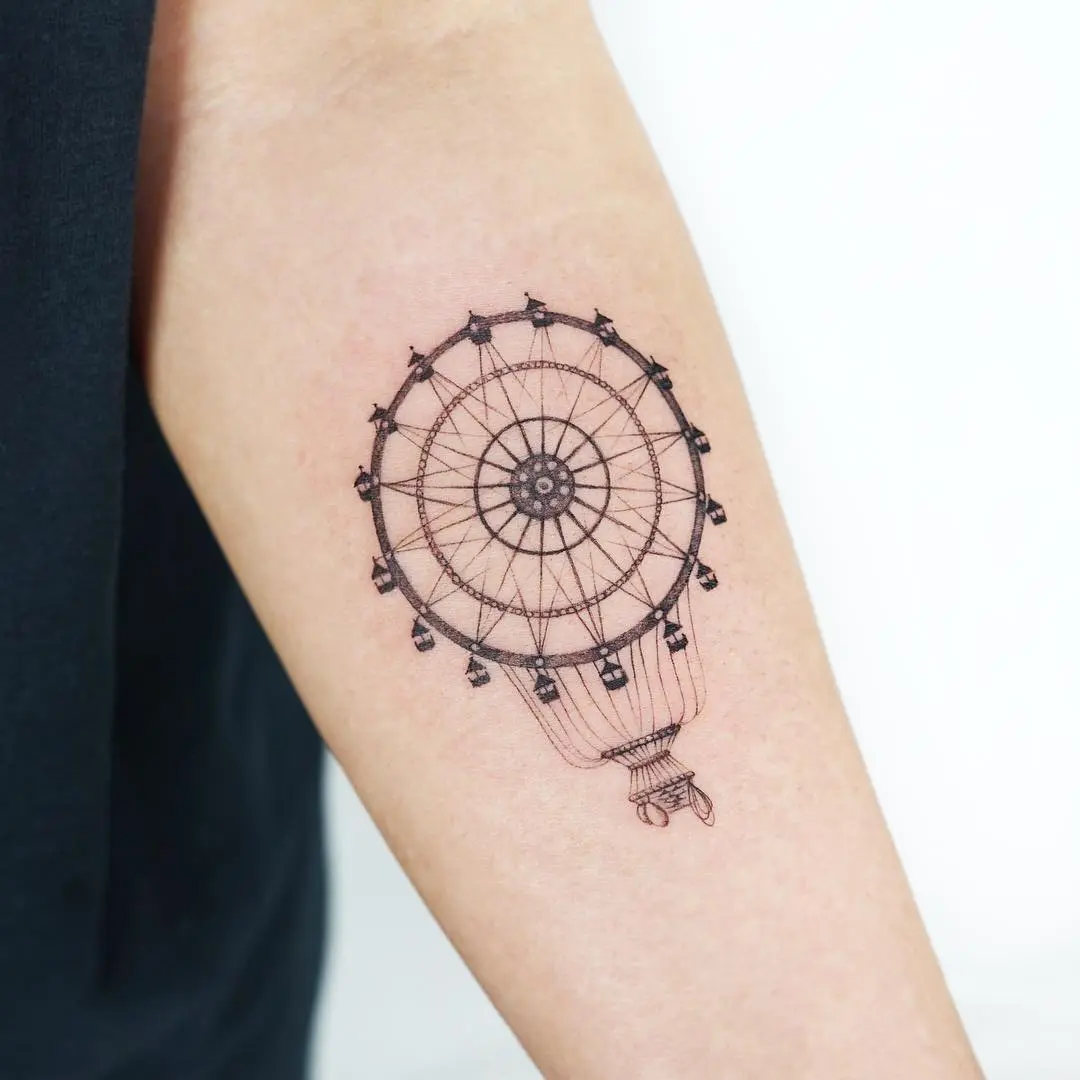 Intricate black outline ferris wheel tattoo design