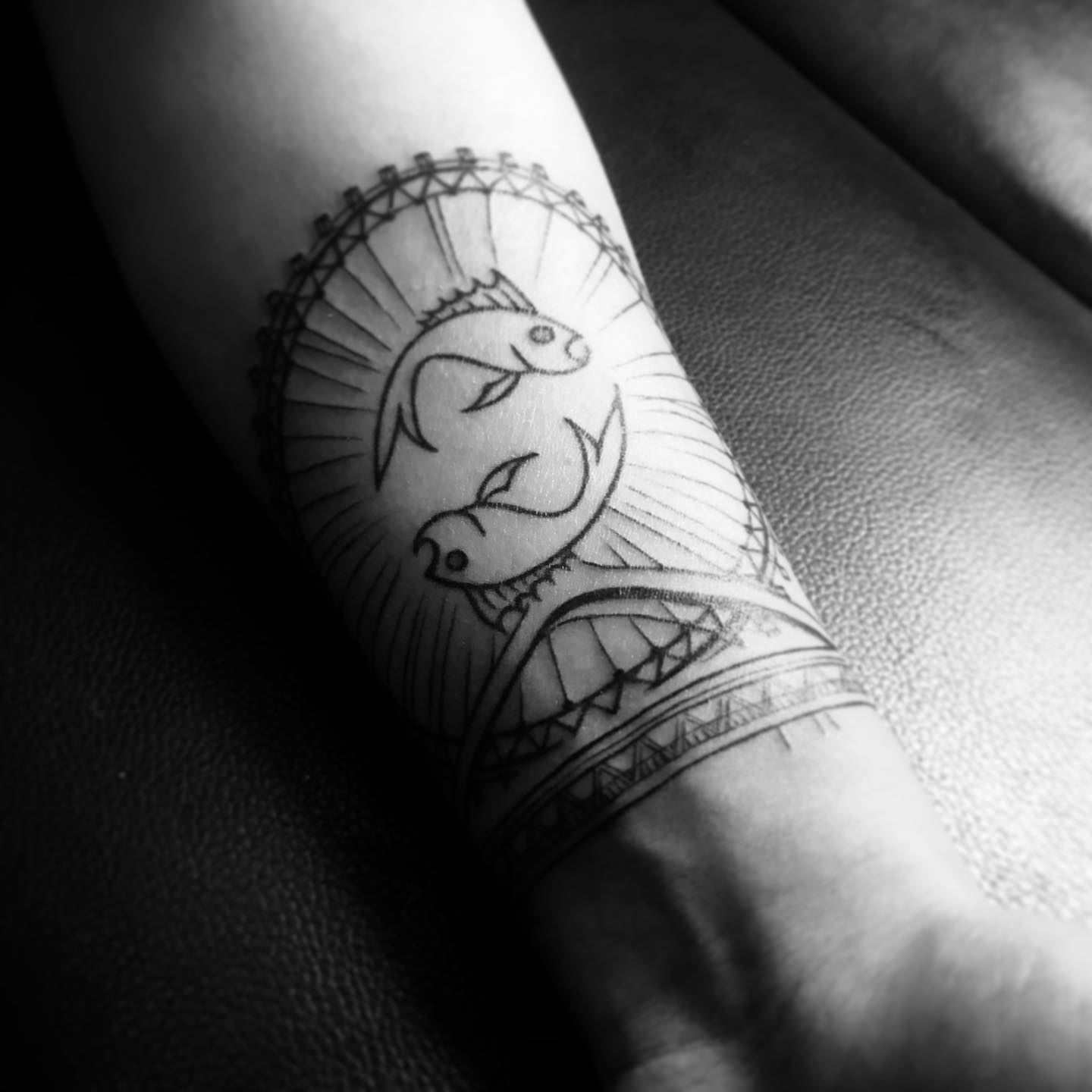 Unique Ferris Wheel Tattoo with Fish Design