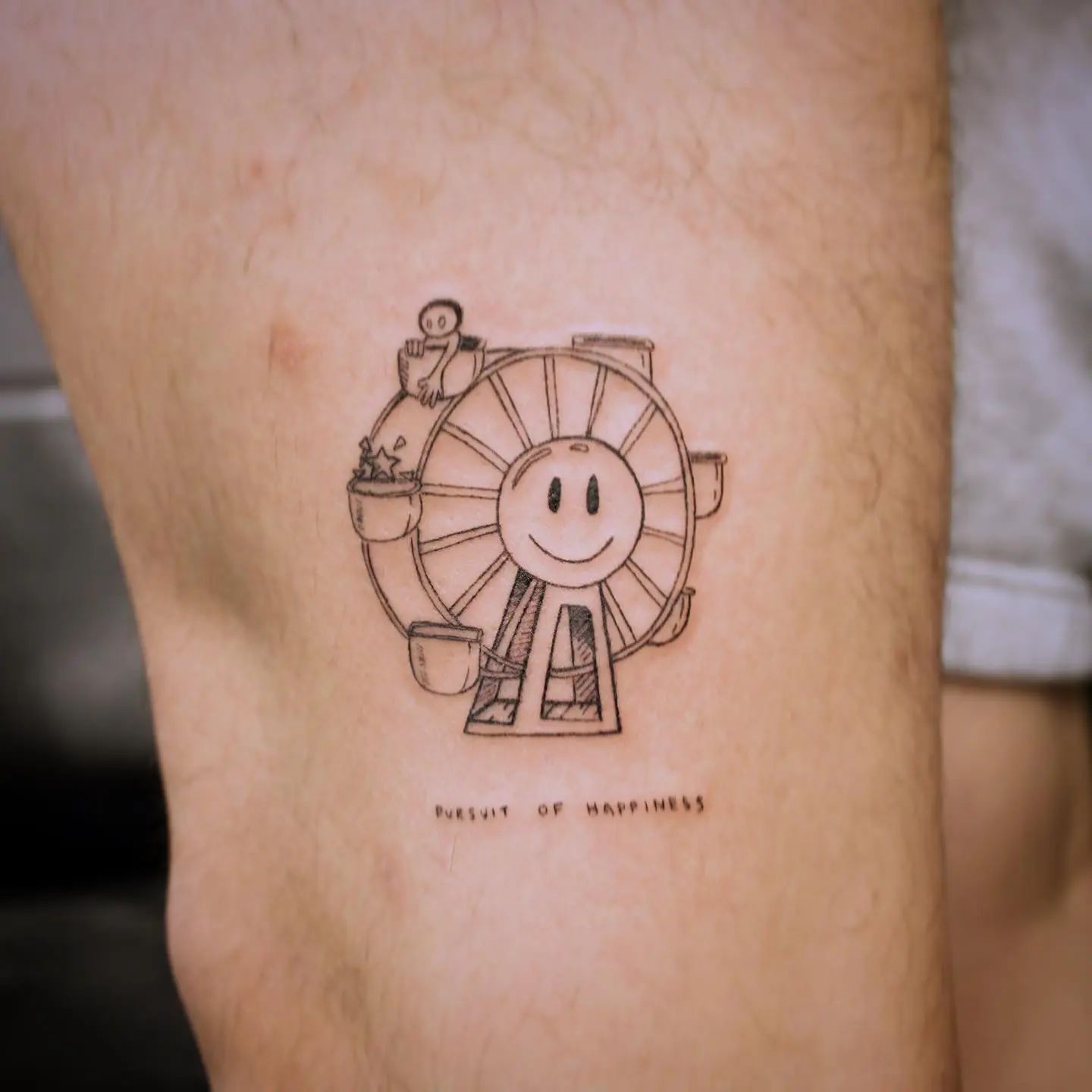 Joyful Ferris Wheel Tattoo with a Smile