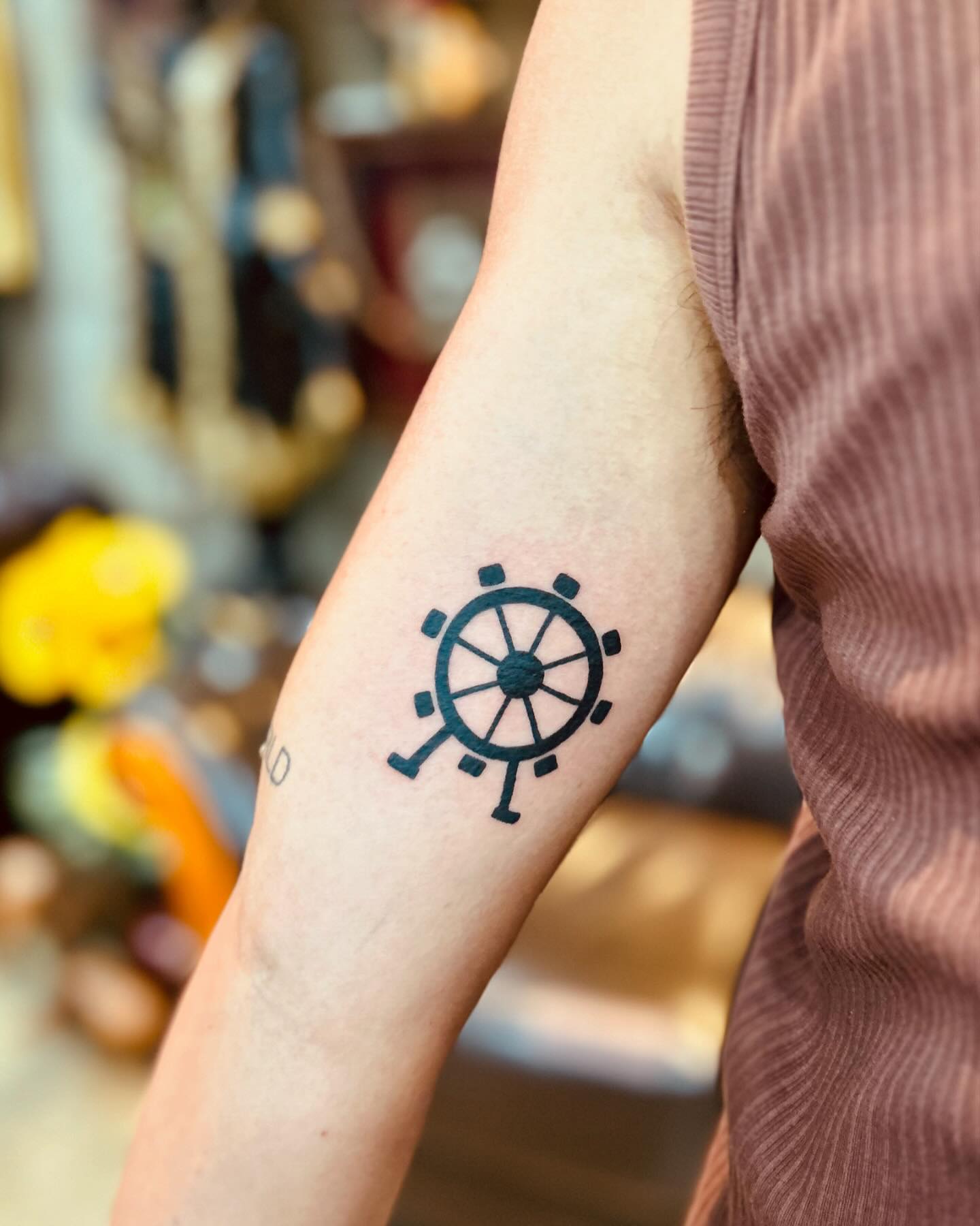 Minimalistic Ferris Wheel Tattoo on Arm