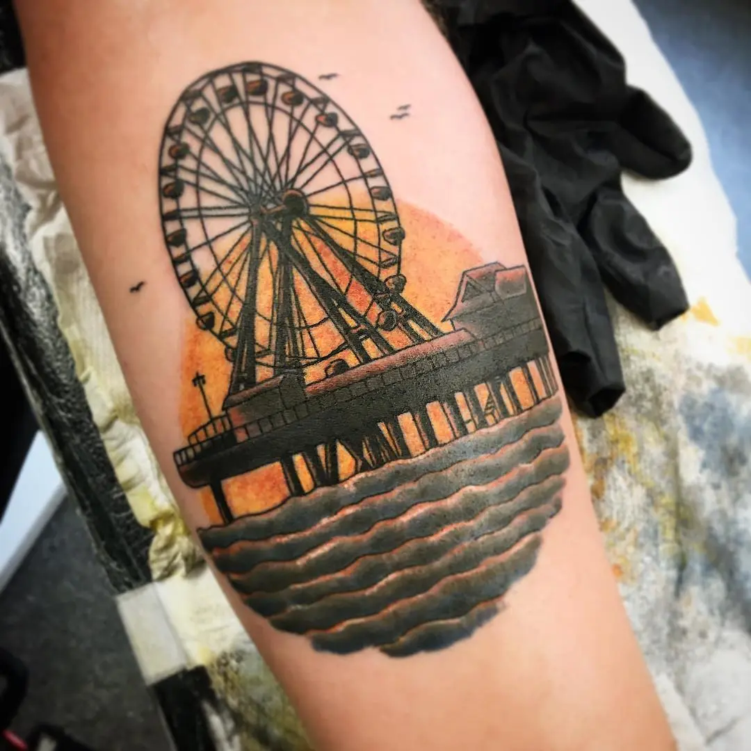 Stunning Ferris Wheel Tattoo by the Sea