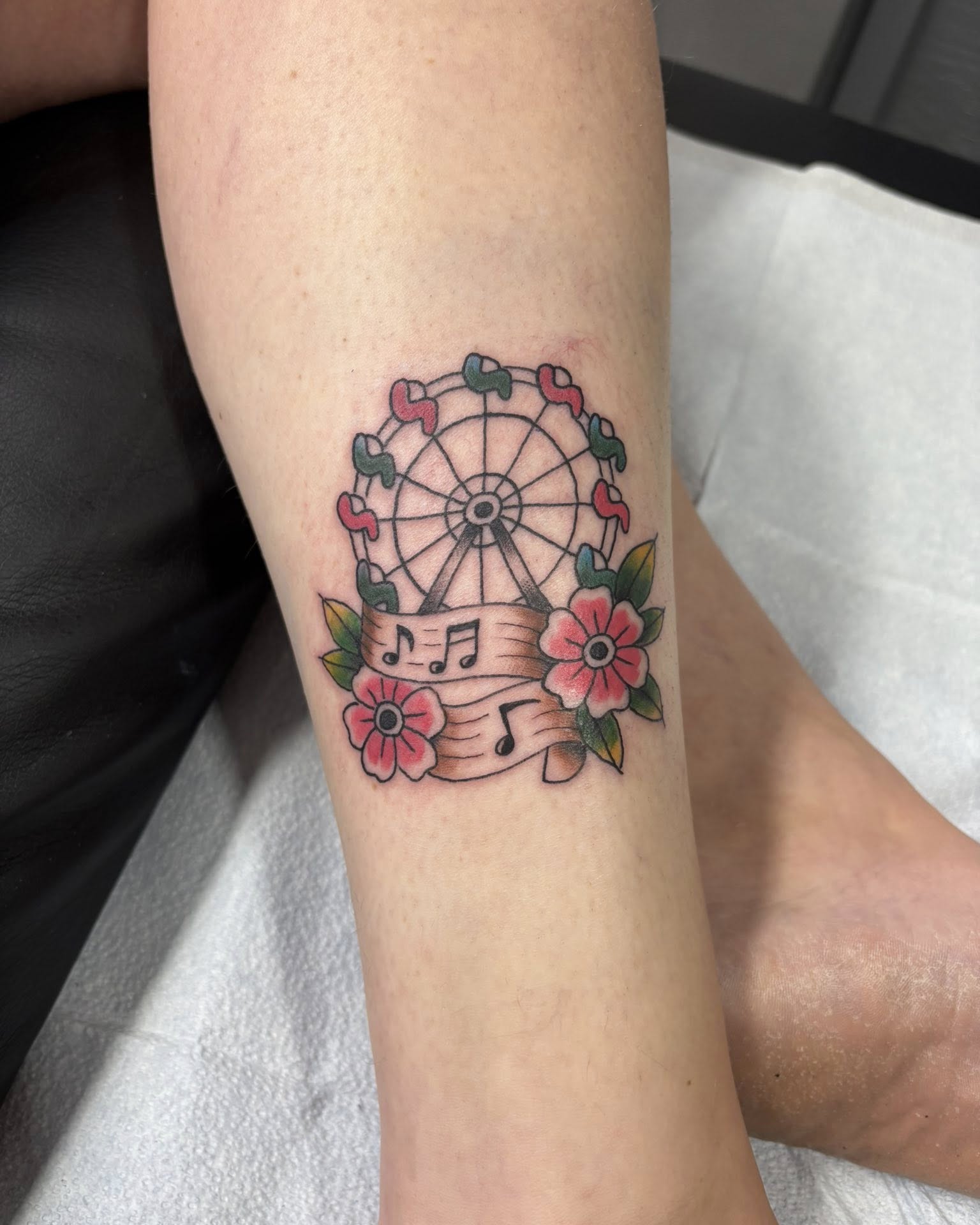 Whimsical Ferris Wheel Tattoo with Floral Details